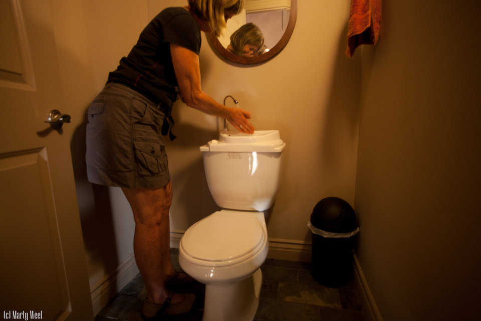 This toilet has dual-function water. Clean water washes your hands, then the toilet.