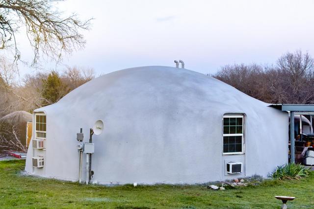 A 32’ diameter Monolithic Dome Home with a new synthetic stucco roof.